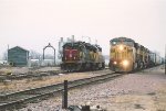 Eastbound manifest passes local power near the turntable